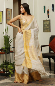 Stone White Linen Saree with a striking Zari Border & pallu