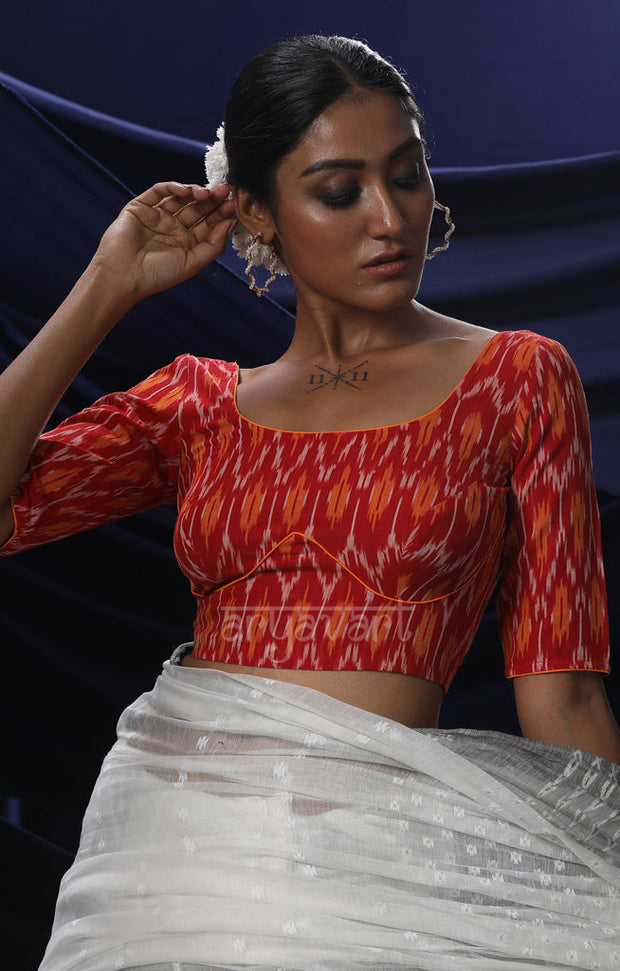 An Ikkat Blouse in a Stunning Combination of Red & Orange