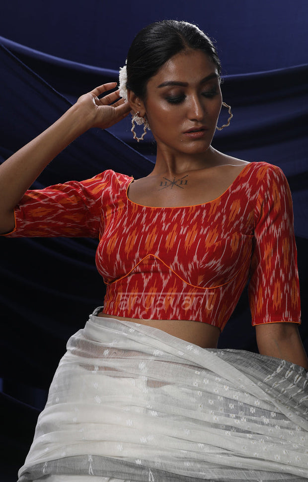 An Ikkat Blouse in a Stunning Combination of Red & Orange