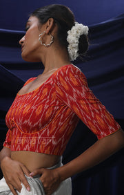 An Ikkat Blouse in a Stunning Combination of Red & Orange