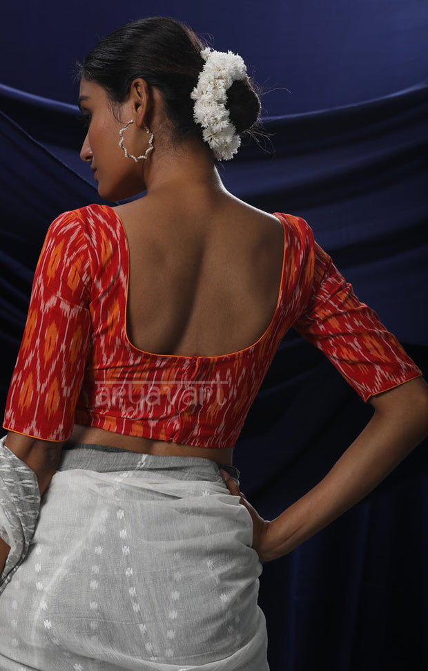 An Ikkat Blouse in a Stunning Combination of Red & Orange