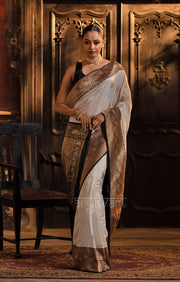 Striking White Katan Silk Saree With A Black Border & Gold Buttas