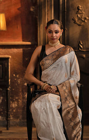 Striking White Katan Silk Saree With A Black Border & Gold Buttas